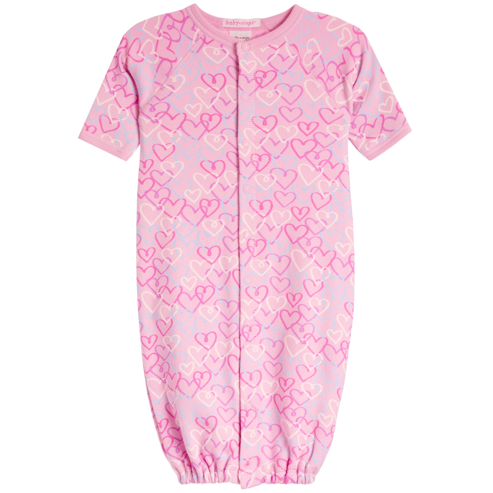 A baby long-sleeve footless sleeper in light pink with an allover pattern of darker pink and white hearts.