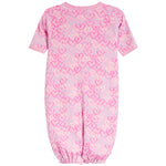 A pink short-sleeve baby jumpsuit with an allover heart pattern in various shades of pink, shown against a plain white background.