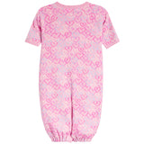A pink short-sleeve baby jumpsuit with an allover heart pattern in various shades of pink, shown against a plain white background.