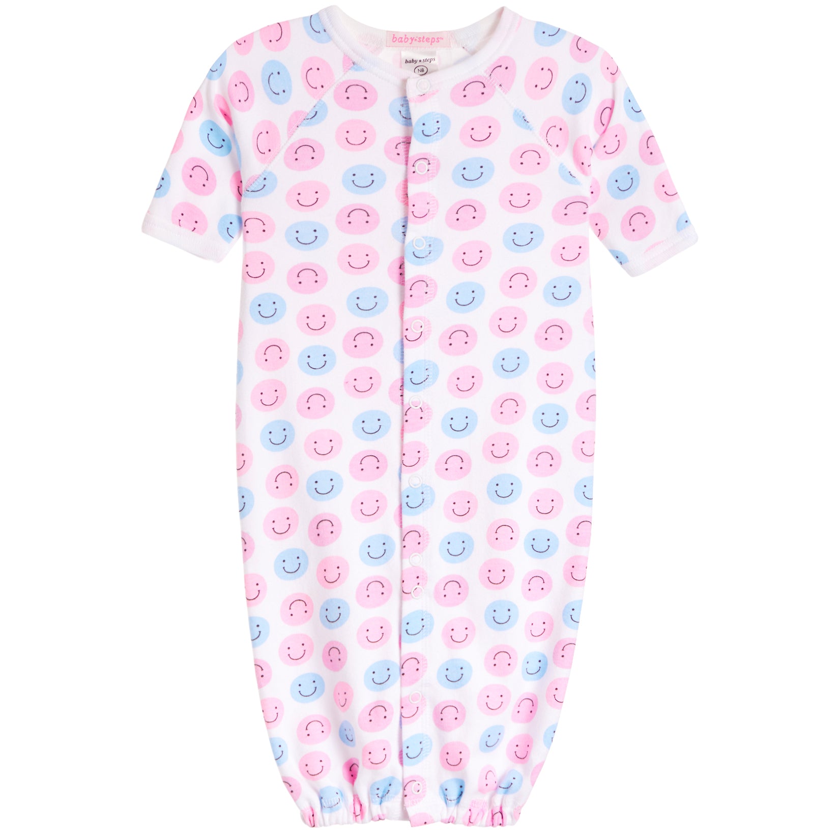 A baby long-sleeve footless sleeper with an all-over pink and blue smiley face pattern, featuring a snap-button front closure and elastic cuffs.