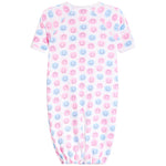 A baby long-sleeve footless sleeper with an all-over pattern of pink and blue smiling face emojis on a white background.