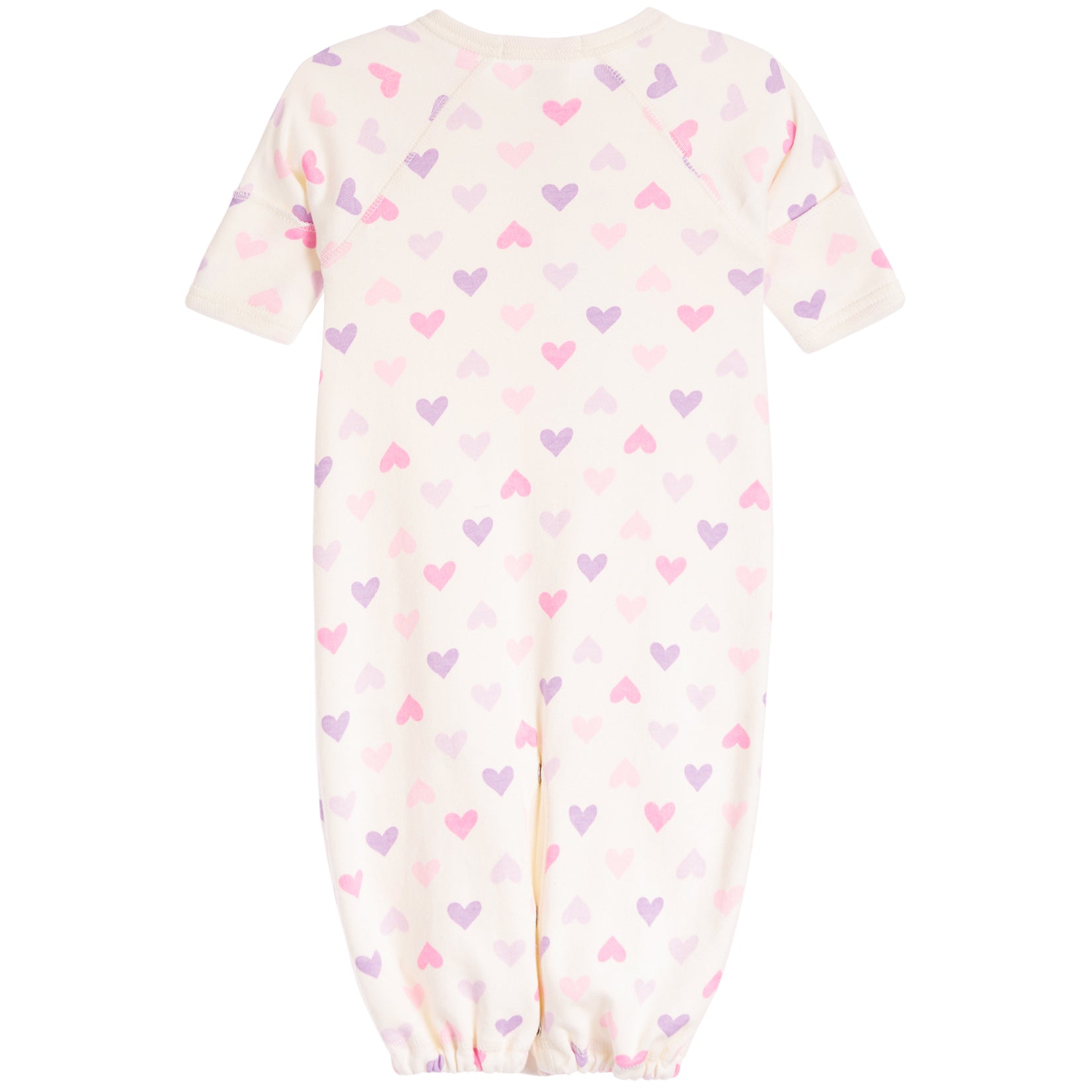 A baby long-sleeve footless one-piece sleeper in cream with an all-over pattern of small pink and purple hearts, shown against a plain white background.
