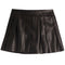 A black faux-leather pleated mini skirt with a wide waistband, shown flat against a solid white background.