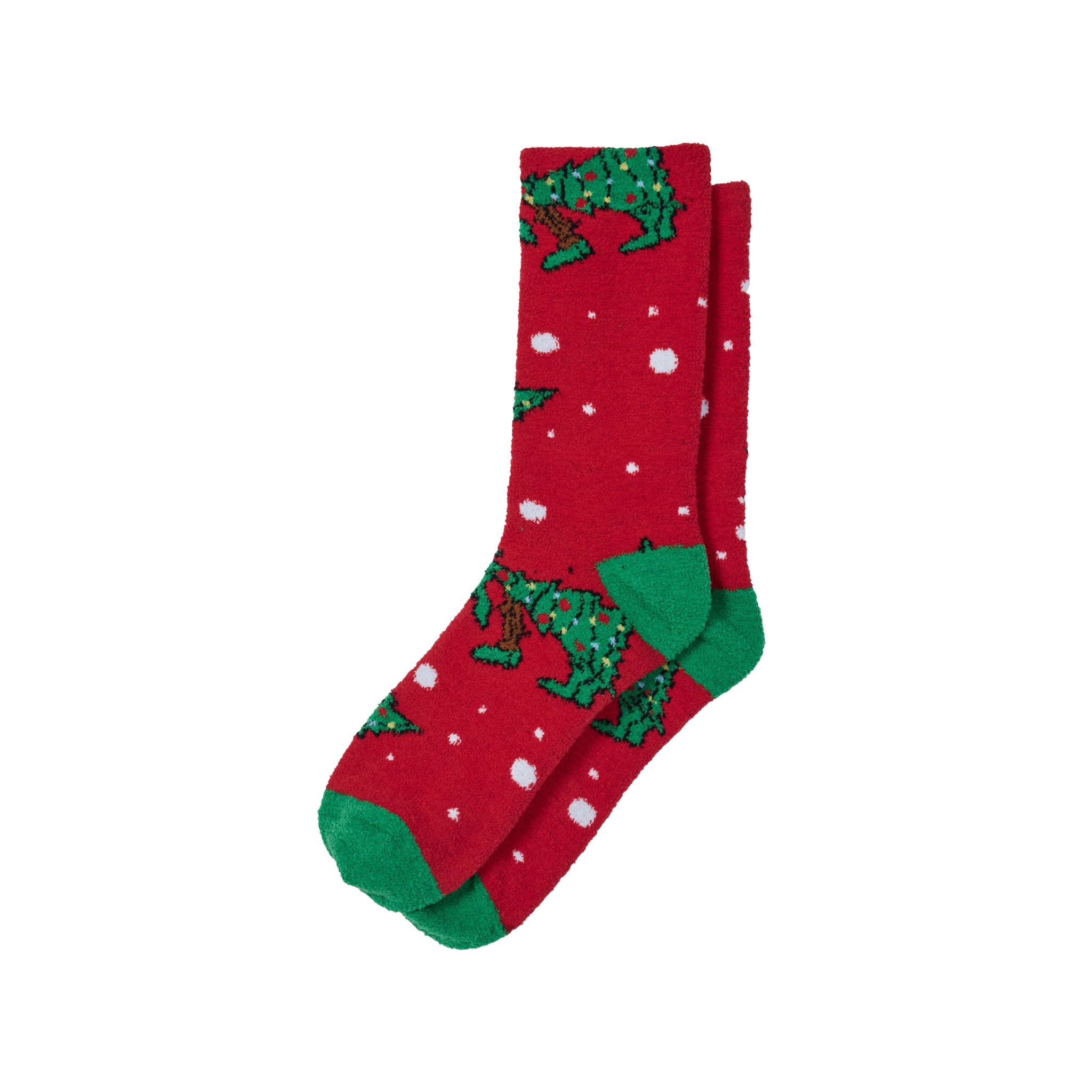 A pair of red crew socks with a green goat Christmas tree pattern and white snowflake details, shown against a plain white background.