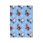 A light blue blanket or throw featuring a repeating pattern of cartoon Santa Claus goat and Snowman goat with white snowflakes, shown on a plain white background.