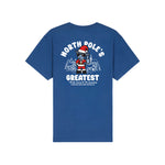 A blue short-sleeve t-shirt shown from the back, featuring a large graphic print of a cartoon goat dressed as Santa Claus with the text 'NORTH POLE'S GREATEST' and a small quote below.