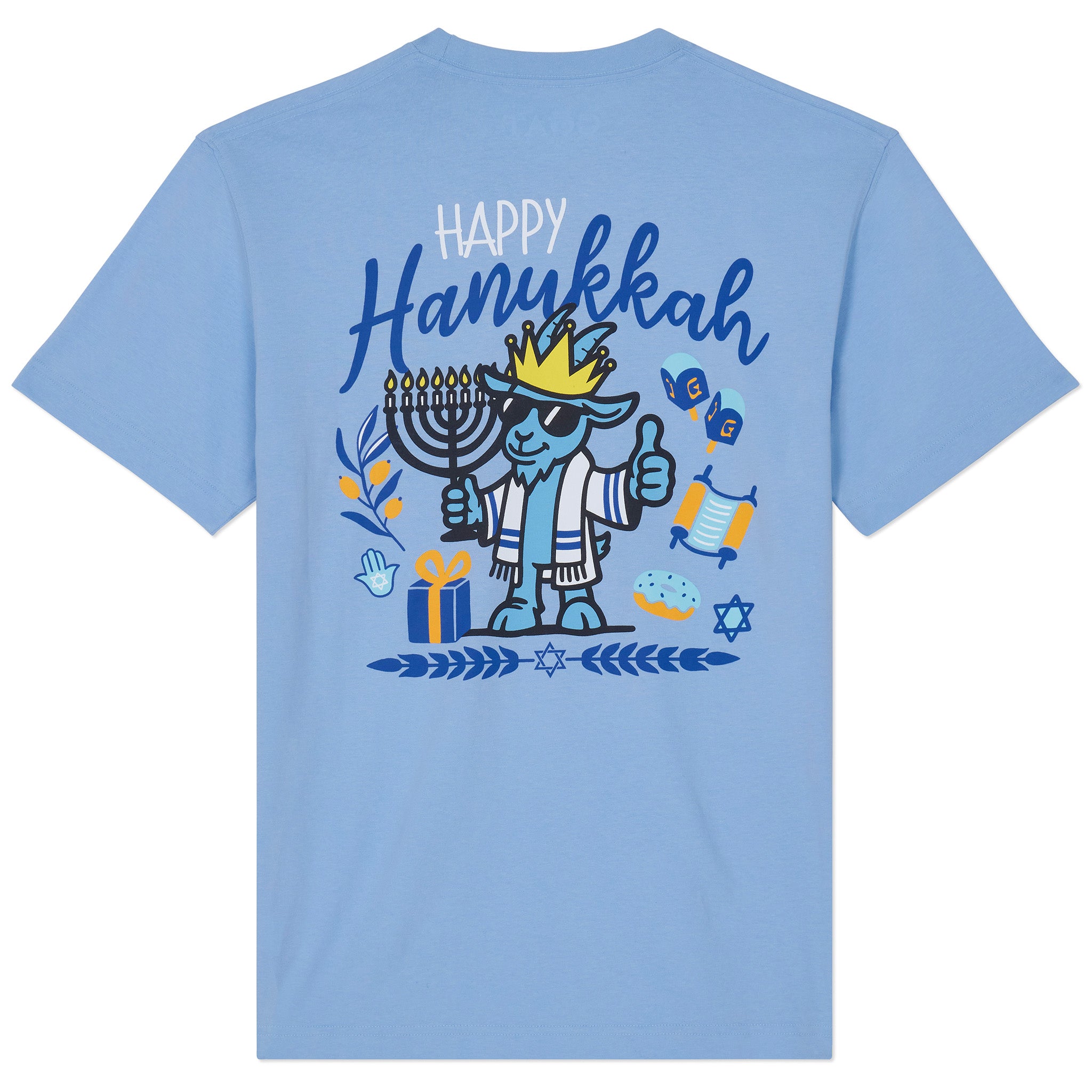 A light blue short-sleeve t-shirt shown from the back, featuring a colorful graphic of a cartoon dog wearing a crown and mezotall, surrounded by Hanukkah symbols including a menorah, dreidels, and gift boxes, with the text 'Happy Hanukkah'.