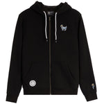 A black zip-up hoodie with white drawstrings, featuring a small embroidered dog graphic on the left chest, a circular patch on the lower left front pocket, and a small graphic on the right sleeve, shown against a plain white background.