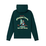 A dark green hooded sweatshirt shown from the back, featuring a large graphic print of a cartoon Christmas tree and the text 'Farm Fresh Christmas Trees Cut and Carry' in red, yellow, and light green.