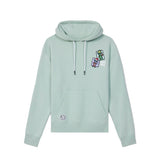 A light mint green pullover hoodie with white drawstrings, featuring a small colorful graphic on the left chest and a circular patch on the front pocket, displayed against a solid white background.