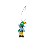 A small decorative hanging ornament goat character wearing a green and yellow striped hat, green top, yellow pants, black shoes, and giving a thumbs-up, suspended by a gold string on a white background.