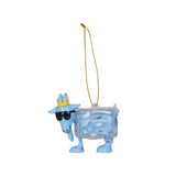 A blue goat-shaped hanging ornament shaped like a clear ice cube, wearing a small gold crown and black sunglasses, with a gold hanging string on a plain white background.