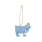 A light blue Christmas ornament shaped like a cartoon creature wearing a small gold crown, with a clear block-like body containing tiny black fish and a gold hanging string, shown on a plain white background.