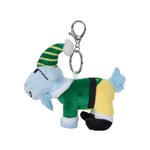 A plush goat character keychain wearing a green and yellow striped elf hat, a green outfit, and black boots, attached to a silver metal clasp on a plain white background.