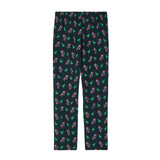 Dark green lounge pants with goats dressed like santa and christmas trees on a white background.
