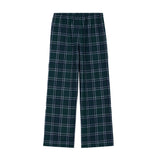 A pair of wide-leg plaid lounge pants in dark green with white and light blue lines, featuring an elastic waistband and a small white embroidered logo on the left thigh.