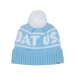 A light blue and white knit beanie hat with a white pom-pom on top. The word 'GOAT USA' is knitted across the front, and a small black fox logo is visible on the lower right cuff.