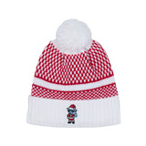 A red and white knit beanie hat with a white pom-pom on top and a white ribbed cuff, featuring a small embroidered goat Santa Claus character on the front.