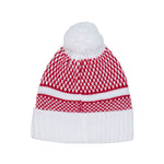 A red and white patterned knit beanie hat with a fluffy white pom-pom on top and a white ribbed cuff, shown against a plain white background.