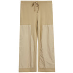 A pair of beige pants with a solid upper section and contrasting light beige patch pockets on the lower legs, featuring a drawstring waistband, shown against a plain white background.