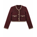 A cropped tweed jacket in a dark red and black micro-tweed pattern, featuring beige and gold trim along the collar, cuffs, hem, and front buttons.