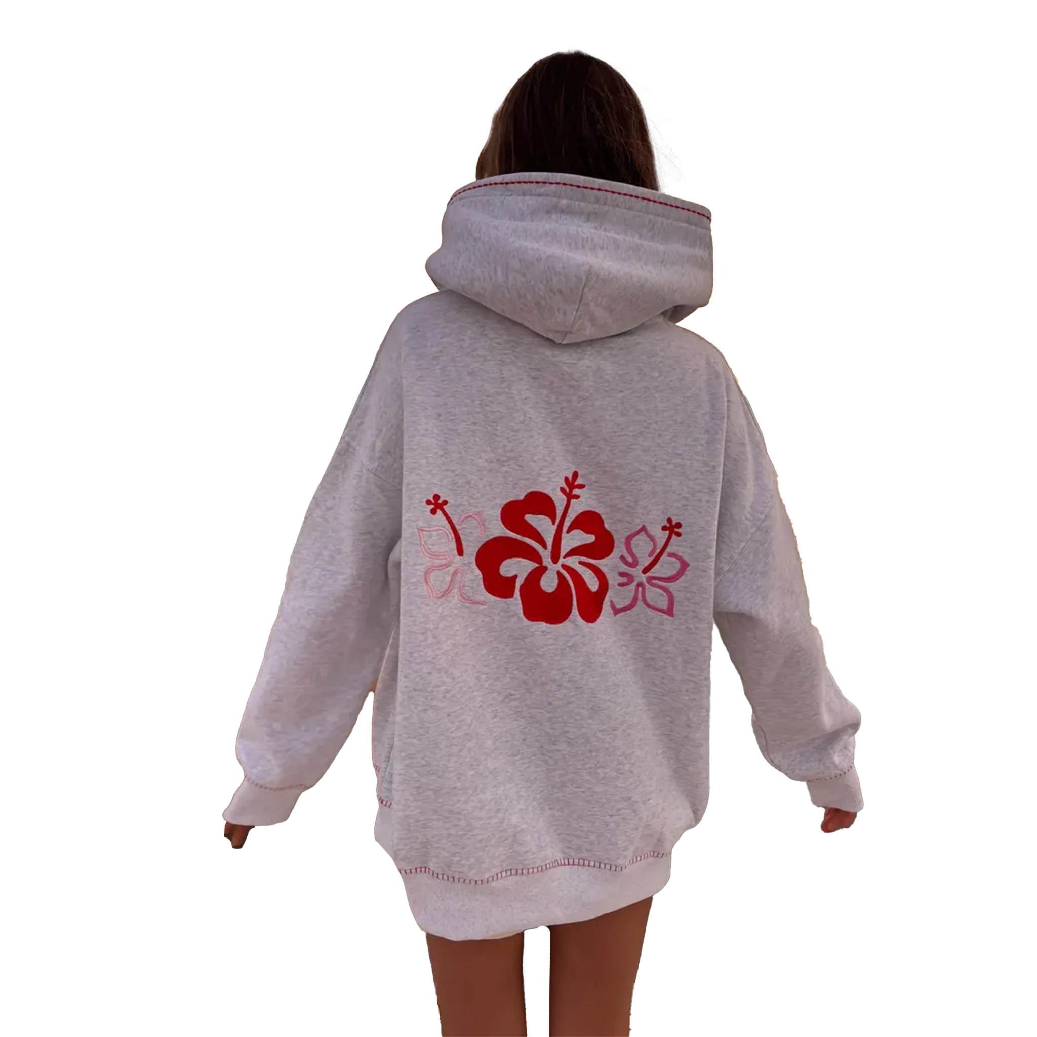 A person viewed from the back wearing an oversized light heather gray hoodie with a large red and pink hibiscus flower graphic across the back, against a plain white background.