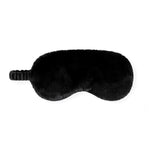 A black plush sleep mask with a textured elastic strap, shown against a plain white background.