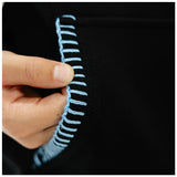 A close-up of a hand holding the edge of a black garment to show light blue contrast stitching.