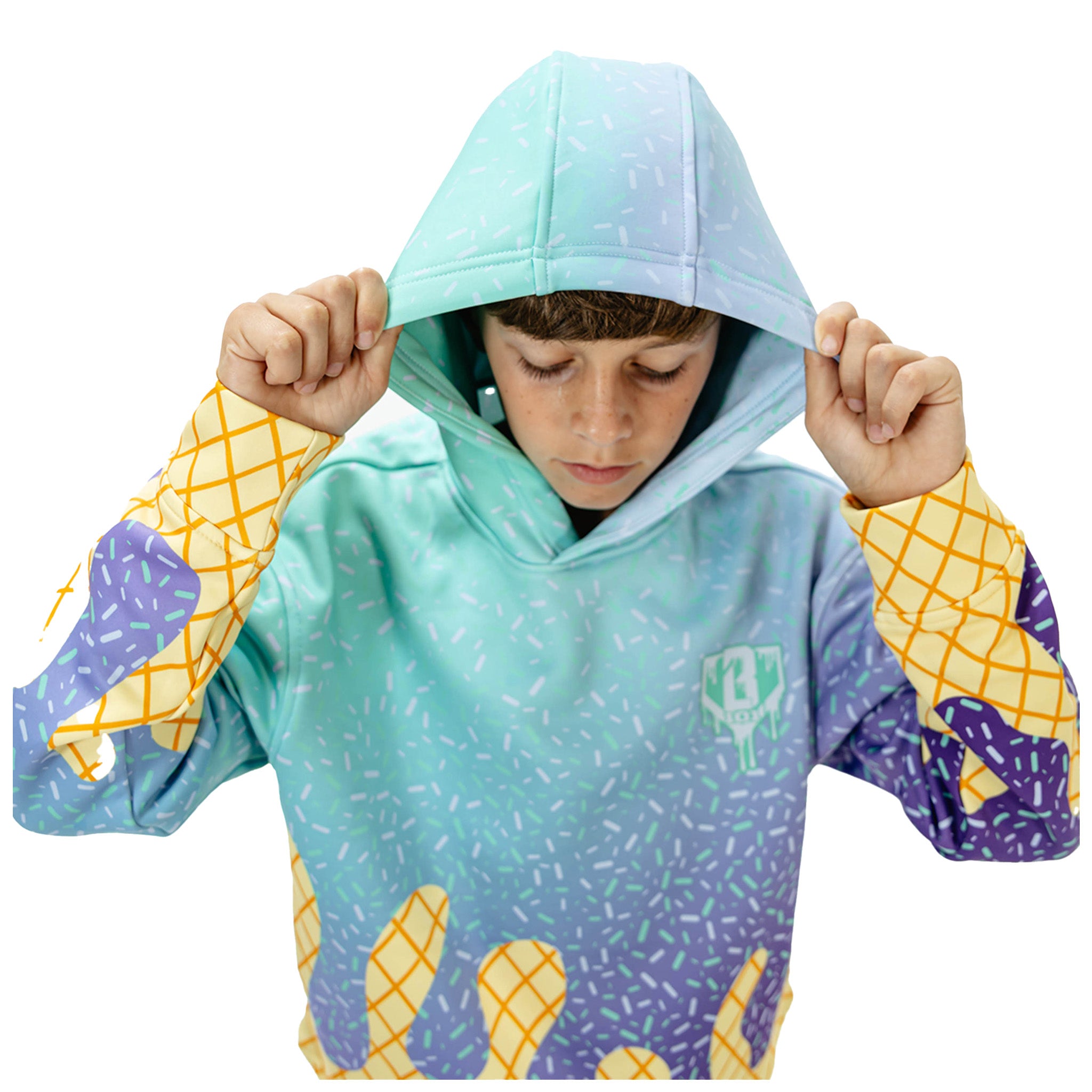 A child wearing a hooded sweatshirt with a mint-to-purple sprinkle gradient and yellow ice cream cone sleeve details, shown against a plain white background.