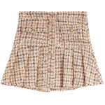 A high-waisted tweed mini skirt with a pleated flared silhouette, featuring a button-front closure and a multicolor woven pattern of beige, brown, and gold.
