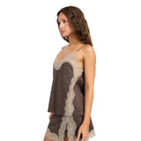 A woman modeling a brown set with beige lace trim, photographed against a solid white background.