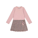 A girls' long-sleeve dress with a solid light pink upper body and sleeves, and a textured tweed skirt in pink, beige, and brown tones with a scalloped hem and a small pink tassel detail.