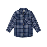 A long-sleeve plaid button-up shirt for a child, featuring a navy blue, white, and light blue tartan pattern, with a chest pocket and brown buttons, shown on a plain white background.