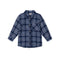 A long-sleeve plaid button-up shirt for a child, featuring a navy blue, white, and light blue tartan pattern, with a chest pocket and brown buttons, shown on a plain white background.