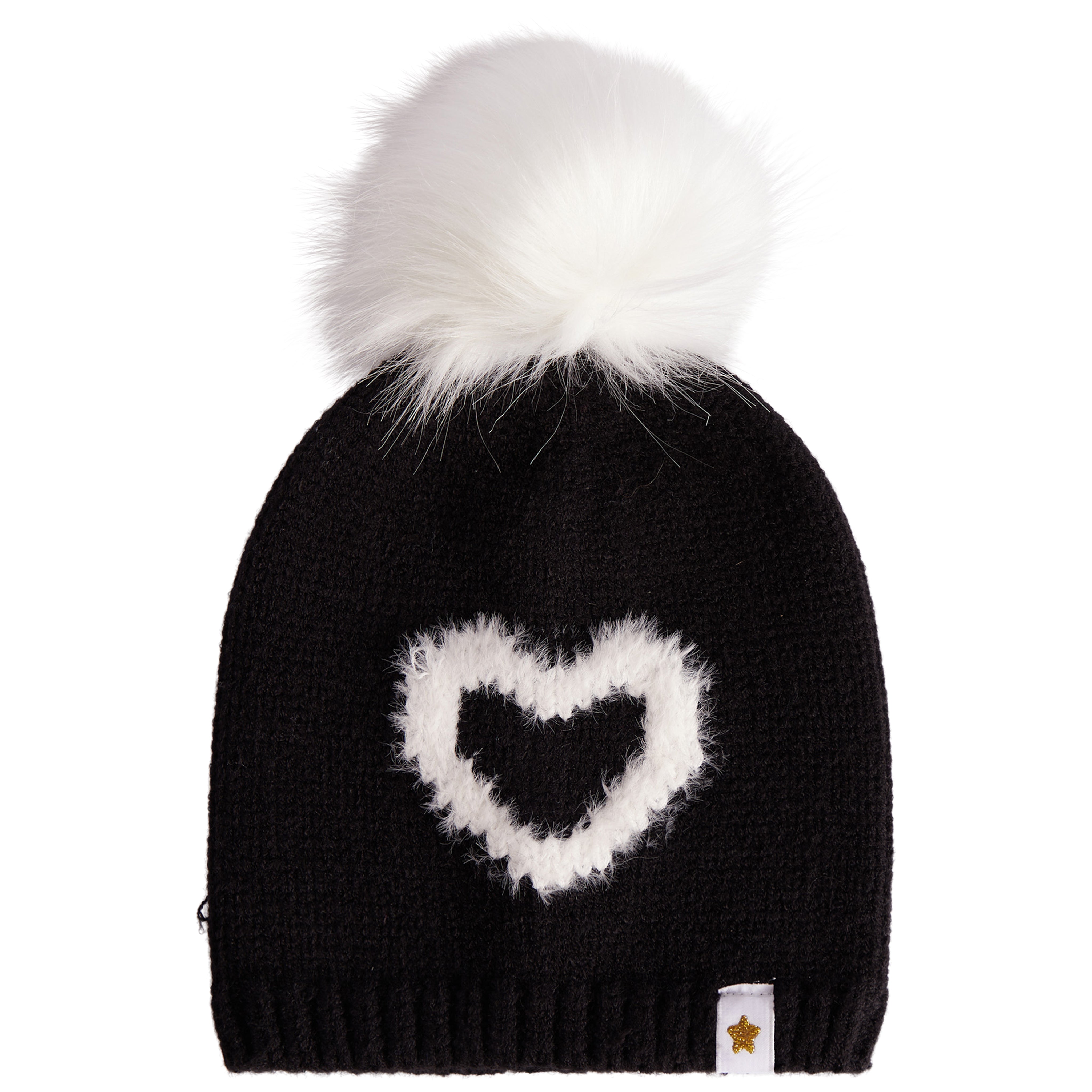 A black knit beanie hat featuring a fluffy white faux-fur pom-pom on top and a white heart-shaped knit motif on the front. A small white fabric tag with a gold star logo is visible on the lower right edge.