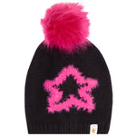 A black knit beanie hat featuring a large, fluffy hot pink pom-pom on top and a matching hot pink fuzzy star graphic on the front. A small white brand tag is visible on the lower right edge.