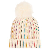 An off-white knit pom-pom beanie decorated with vertical columns of colorful rhinestones, featuring a fluffy cream pom-pom on top.