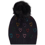 A black knit pom-pom beanie featuring a pattern of small, colorful glittery hearts in various shades, set against a plain white background.