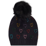 A black knit pom-pom beanie featuring a pattern of small, colorful glittery hearts in various shades, set against a plain white background.