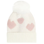 An off-white knit pom-pom beanie featuring three textured pink hearts on the front and a ribbed cuff, set against a plain white background.