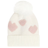An off-white knit pom-pom beanie featuring three textured pink hearts on the front and a ribbed cuff, set against a plain white background.