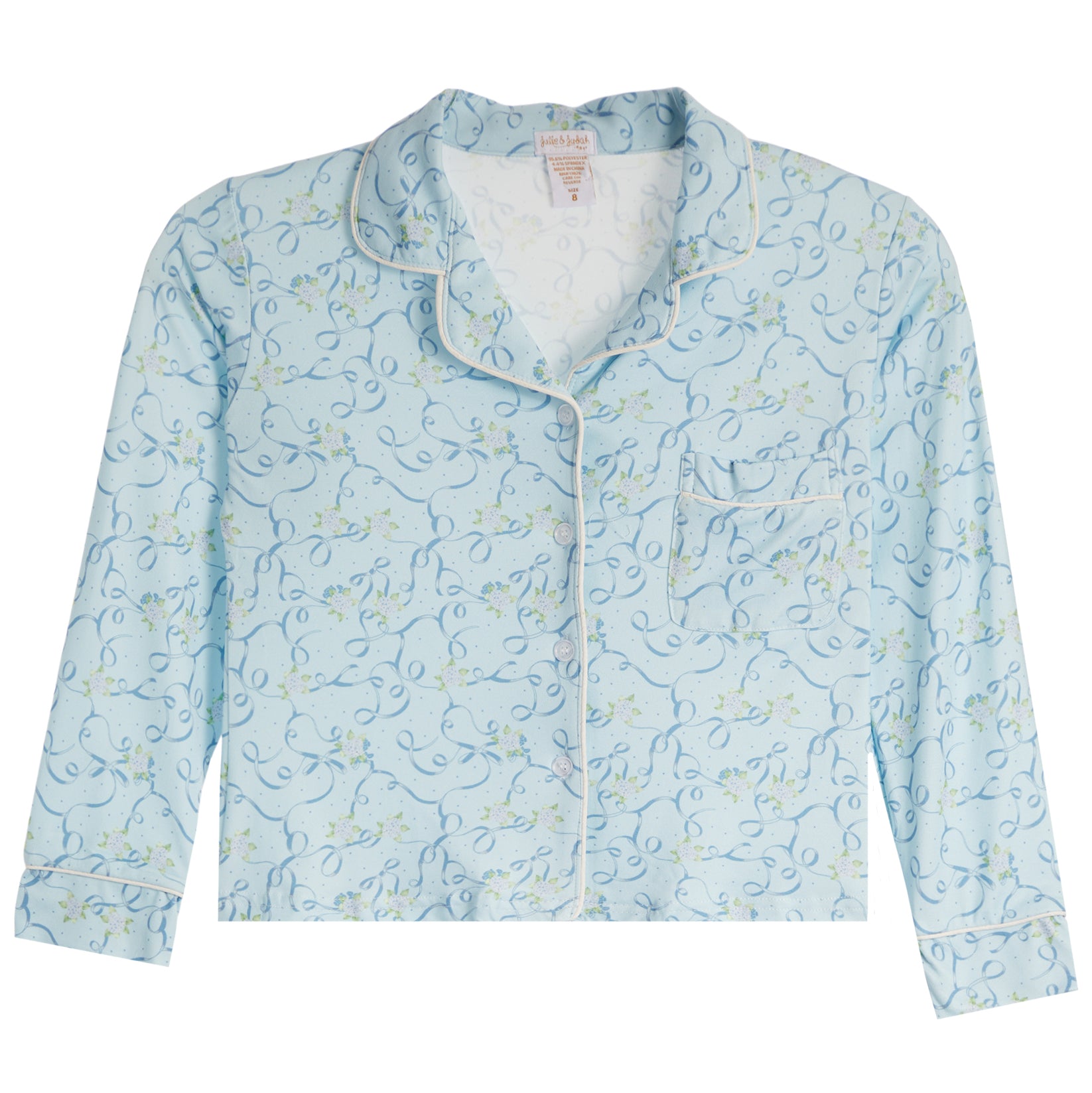 A light blue long-sleeve pajama shirt with a delicate floral and vine pattern, featuring white piping along the collar, placket, and cuffs, and a white inner lining.