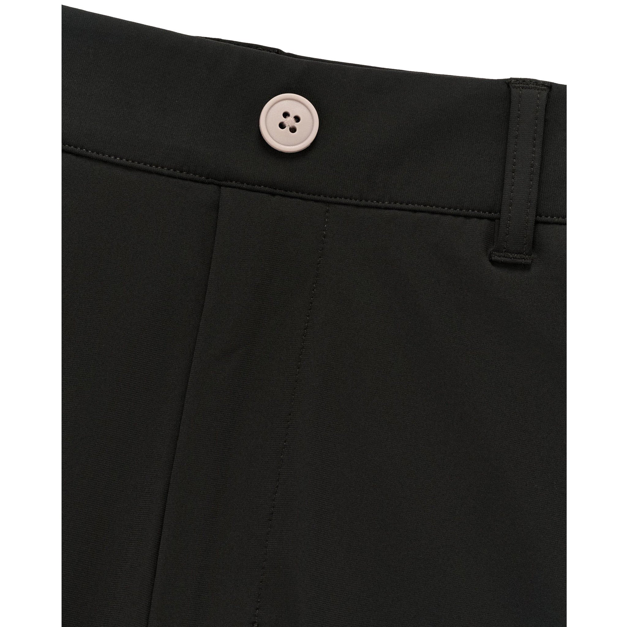 Close-up of black shorts showing the waistband with a single light-colored button and belt loop.