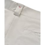 Close-up of light gray shorts showing the waistband, a fabric brand tag reading 'johnnie o' with a red 'O', and part of a side pocket.