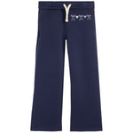 Navy blue sweatpants with a white drawstring and a small white bows with hearts on the left hip, shown against a plain white background.