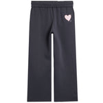 Dark charcoal gray wide-leg sweatpants with an elastic waistband and a small light pink heart graphic on the upper left leg.