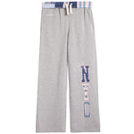 A pair of heather gray sweatpants featuring a vertical 'NYC' graphic on the left leg in a pattern, with a matching patterned waistband and drawstring.