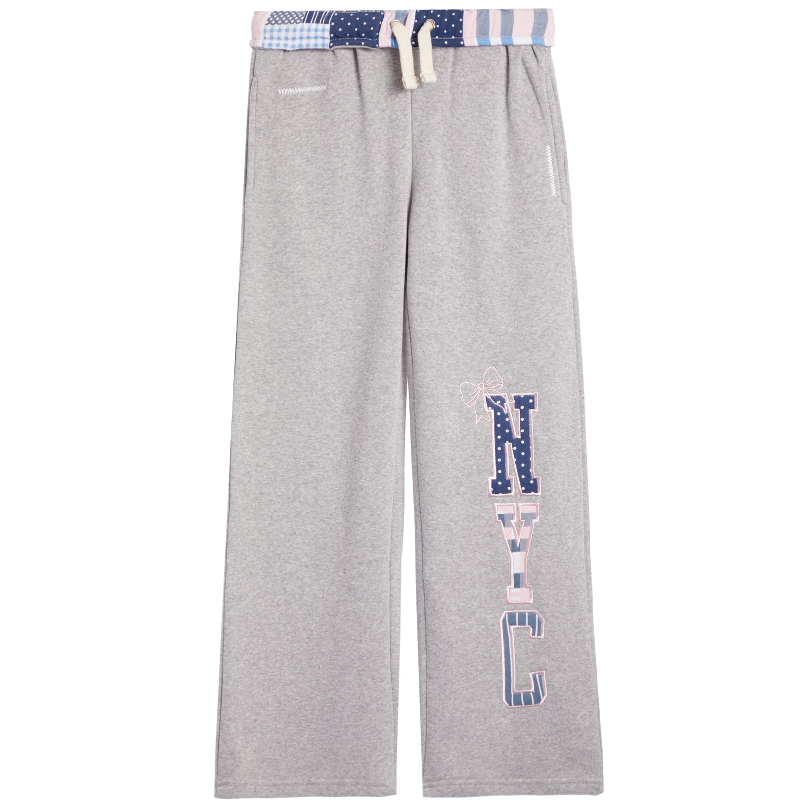 A pair of heather gray sweatpants featuring a vertical 'NYC' graphic on the left leg in a pattern, with a matching patterned waistband and drawstring.