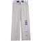 A pair of heather gray sweatpants featuring a vertical 'NYC' graphic on the left leg in a pattern, with a matching patterned waistband and drawstring.