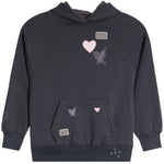 A dark charcoal gray pullover hoodie with a kangaroo pocket, decorated with pink heart graphics, silver glitter motifs, and small rectangular metallic patches.